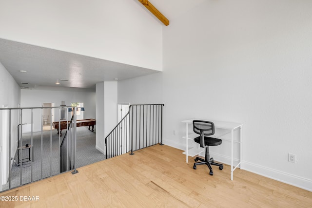 4690 S Atlantic Ave, Ponce Inlet, FL 32127 - office featuring wood finished floors, beam ceiling, and high vaulted ceiling