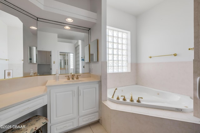 4690 S Atlantic Ave, Ponce Inlet, FL 32127 - full bath featuring a whirlpool tub, vanity, tile patterned flooring, and recessed lighting