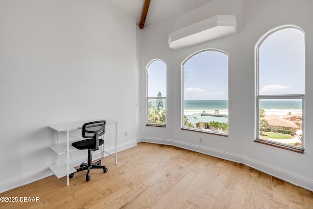 4690 S Atlantic Ave, Ponce Inlet, FL 32127 - unfurnished office featuring wood finished floors and a water view