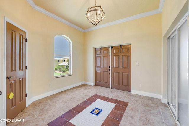 4690 S Atlantic Ave, Ponce Inlet, FL 32127 - tiled foyer featuring a chandelier and crown molding