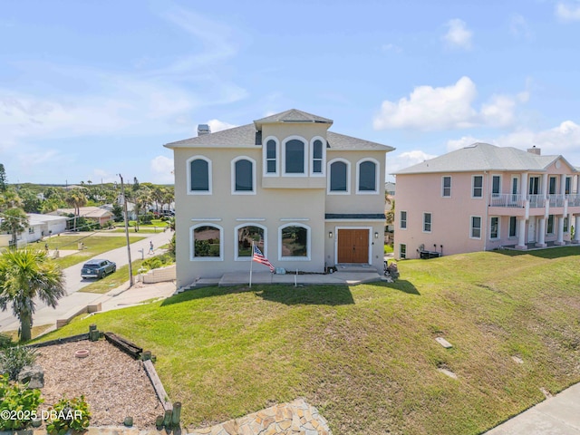 4690 S Atlantic Ave, Ponce Inlet, FL 32127 - mediterranean / spanish house featuring stucco siding and a front yard