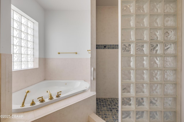4690 S Atlantic Ave, Ponce Inlet, FL 32127 - bathroom featuring a garden tub and a tile shower