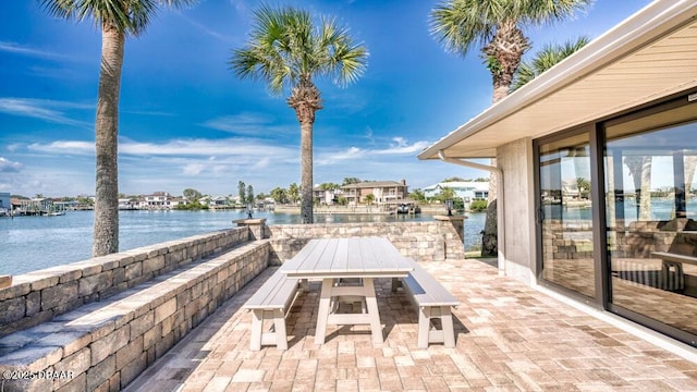 view of patio featuring a water view