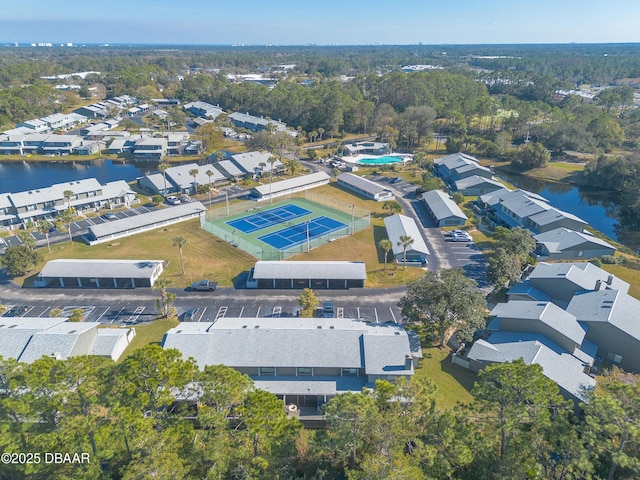 birds eye view of property featuring a water view