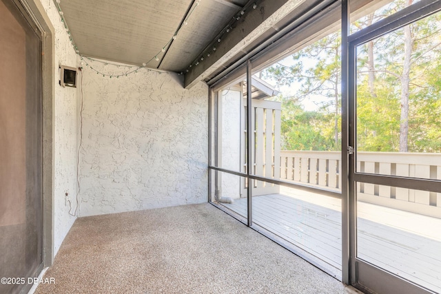 unfurnished sunroom featuring plenty of natural light