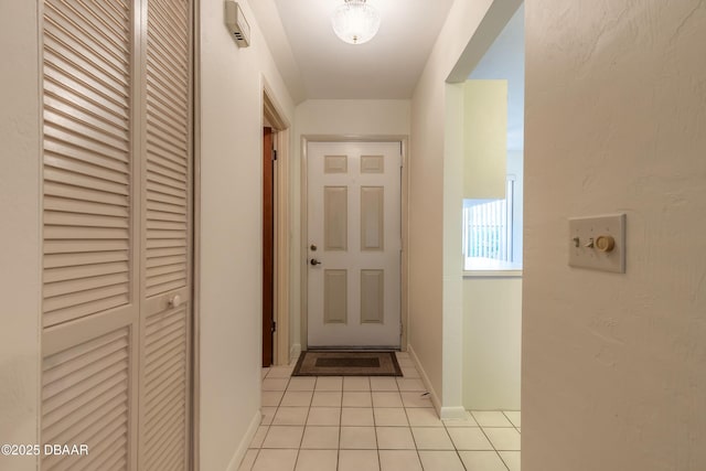 entryway featuring light tile patterned floors