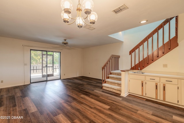 unfurnished living room with sink, ceiling fan with notable chandelier, and dark hardwood / wood-style flooring