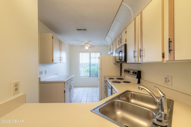 kitchen with ceiling fan, white electric stove, sink, and light tile patterned floors