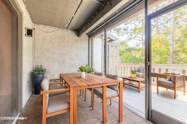 140 Limewood Pl Unit 2, Ormond Beach, FL 32174 - sunroom with rail lighting and outdoor dining space