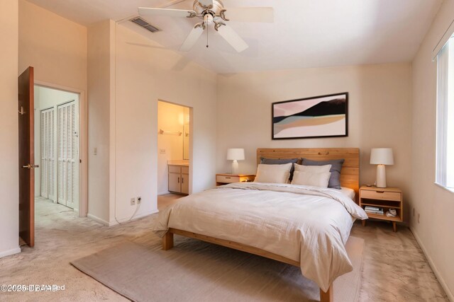 140 Limewood Pl Unit 2, Ormond Beach, FL 32174 - bedroom with light colored carpet, baseboards, ensuite bath, and a ceiling fan