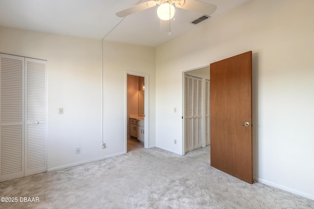 unfurnished bedroom with light carpet and ceiling fan