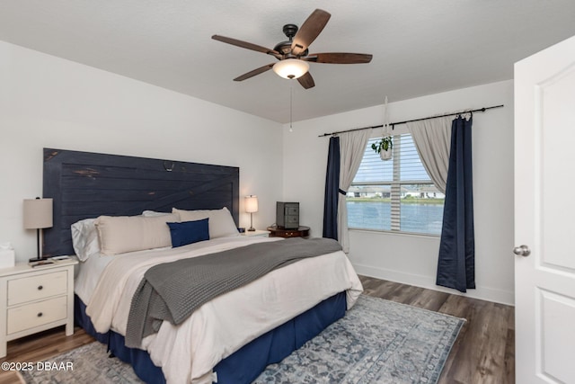 bedroom featuring dark hardwood / wood-style floors and ceiling fan