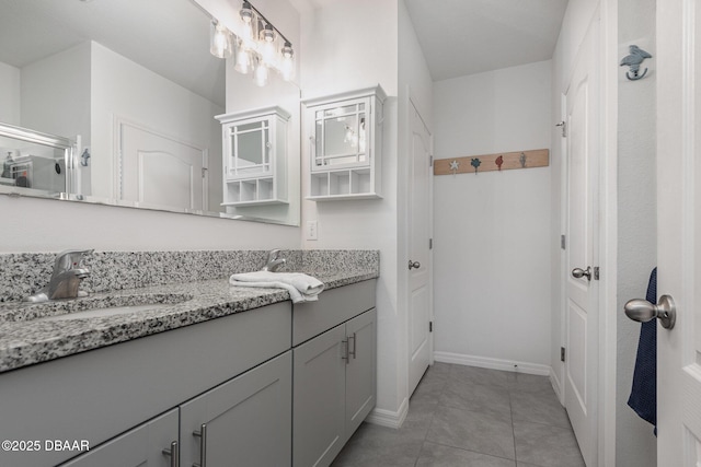 bathroom with tile patterned flooring and vanity