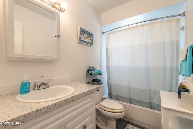 bathroom featuring vanity, shower / tub combo, and toilet