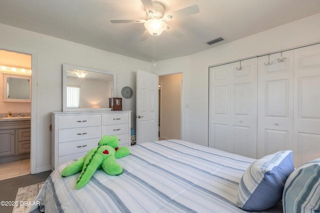 bedroom featuring visible vents, a ceiling fan, a sink, a closet, and connected bathroom