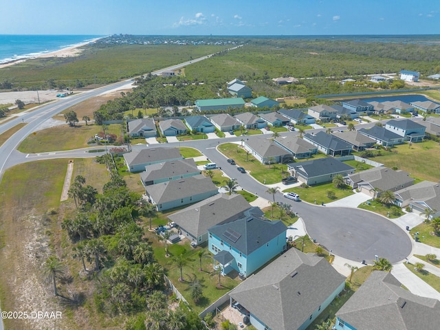 aerial view featuring a water view and a residential view