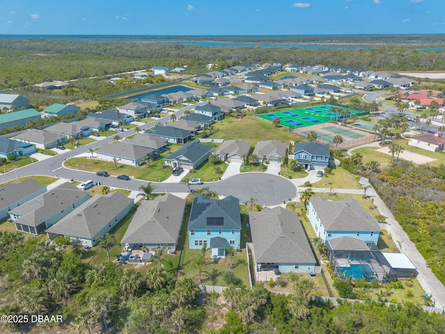 birds eye view of property with a residential view