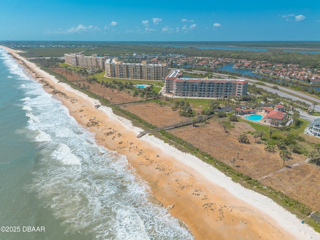 aerial view with a view of the beach and a water view