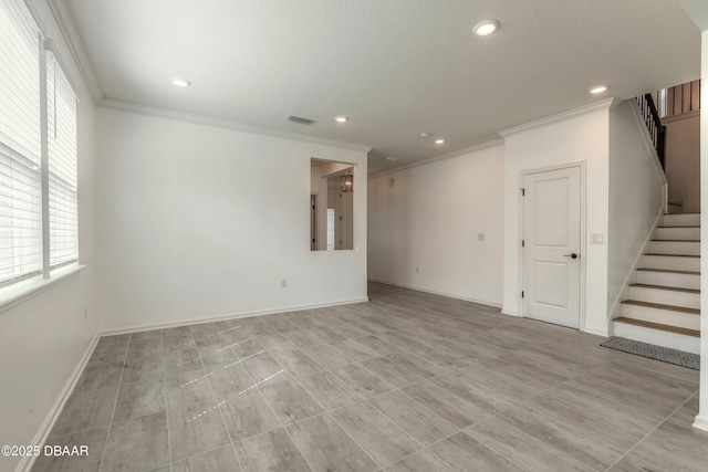 unfurnished living room featuring ornamental molding, stairs, and visible vents