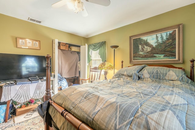 bedroom with ceiling fan and a closet