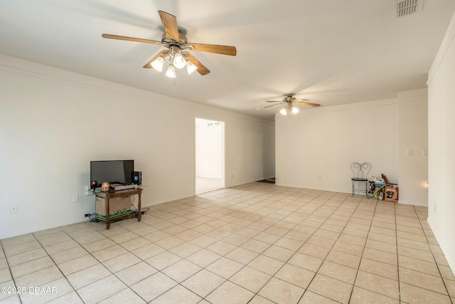 tiled spare room with ceiling fan and ornamental molding