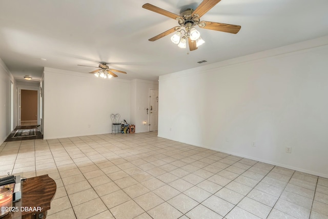 unfurnished room with ceiling fan and ornamental molding