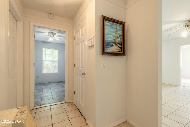 corridor with light tile patterned floors