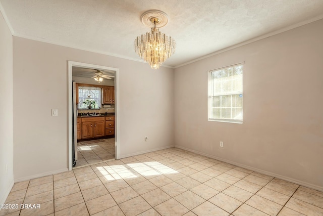 empty room with ceiling fan with notable chandelier, ornamental molding, a textured ceiling, and light tile patterned floors