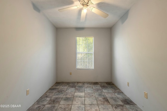 spare room featuring ceiling fan