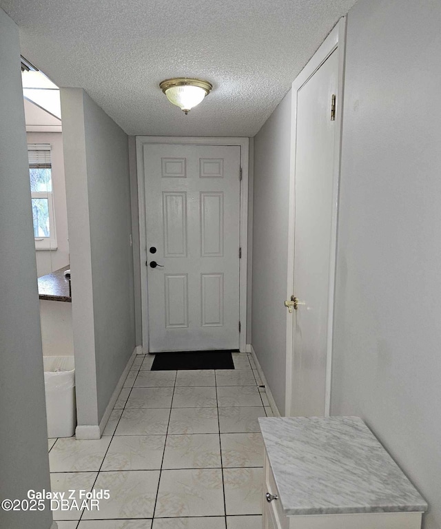 entryway featuring a textured ceiling