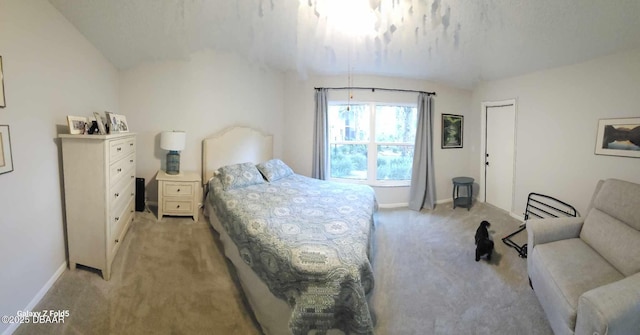 carpeted bedroom featuring vaulted ceiling