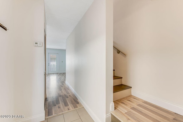 stairway with hardwood / wood-style floors