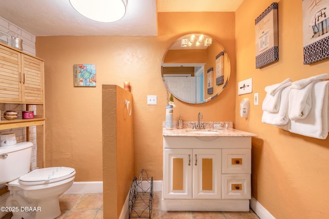 313 S Atlantic Avenue 302 & 304, Daytona Beach, FL 32118 - bathroom featuring vanity, tile patterned flooring, and a textured wall