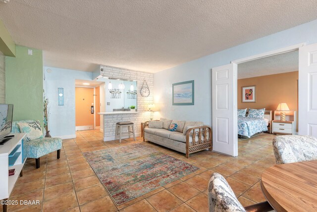 313 S Atlantic Avenue 302 & 304, Daytona Beach, FL 32118 - living room featuring tile patterned floors and a textured ceiling