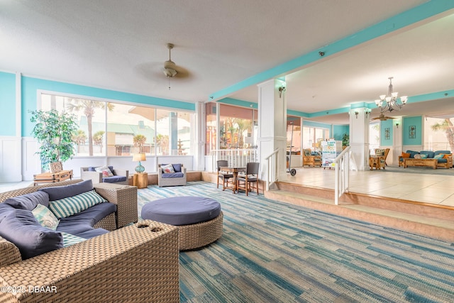 313 S Atlantic Avenue 302 & 304, Daytona Beach, FL 32118 - carpeted living area with a ceiling fan and a chandelier
