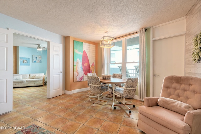 313 S Atlantic Avenue 302 & 304, Daytona Beach, FL 32118 - dining area with a textured ceiling, a chandelier, and light tile patterned floors
