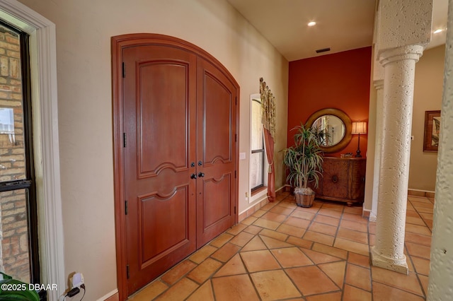 6 Rosalyn Lndg, Daytona Beach, FL 32118 - entryway featuring ornate columns, recessed lighting, and light tile patterned floors