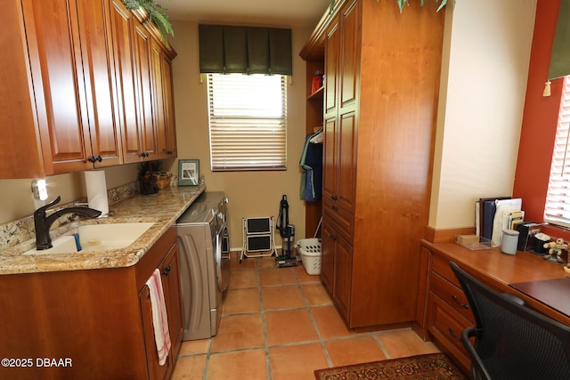 6 Rosalyn Lndg, Daytona Beach, FL 32118 - laundry room with washing machine and clothes dryer, cabinet space, a desk, and light tile patterned flooring