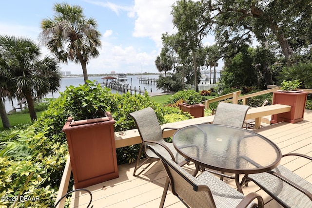 6 Rosalyn Lndg, Daytona Beach, FL 32118 - wooden terrace with a water view and outdoor dining area