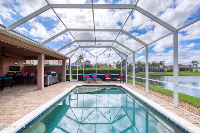 view of pool featuring a patio, a grill, outdoor lounge area, a water view, and a lanai