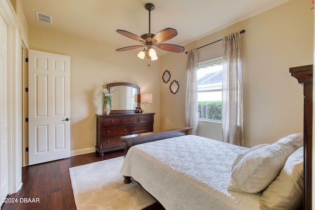 bedroom with dark wood-type flooring and ceiling fan