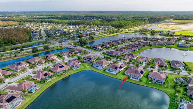 birds eye view of property featuring a water view