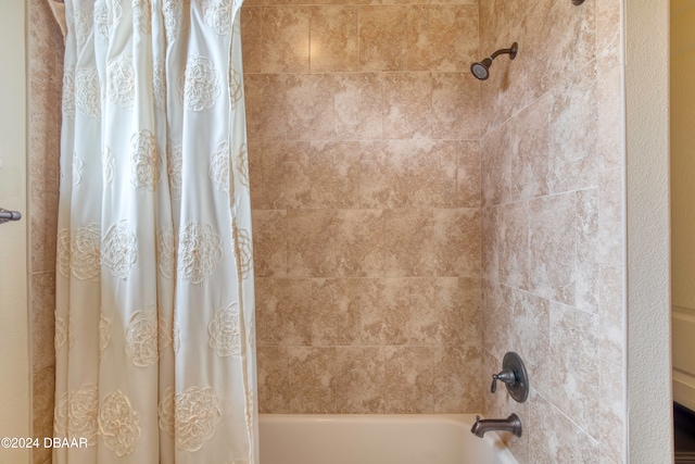 bathroom with shower / bath combination with curtain