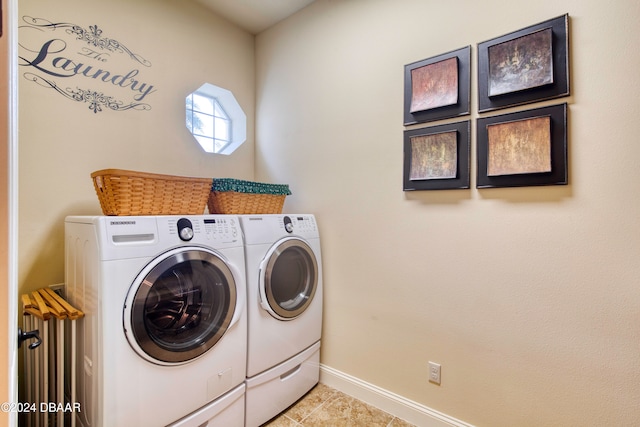 washroom featuring separate washer and dryer and light tile patterned floors