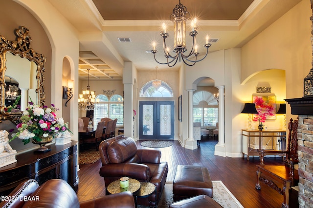 entryway with french doors, ornamental molding, coffered ceiling, dark wood-type flooring, and a tray ceiling