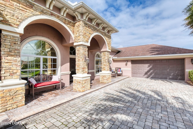 view of patio / terrace featuring a garage