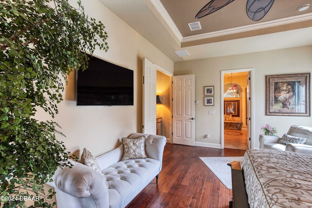 bedroom featuring dark hardwood / wood-style floors and ensuite bathroom