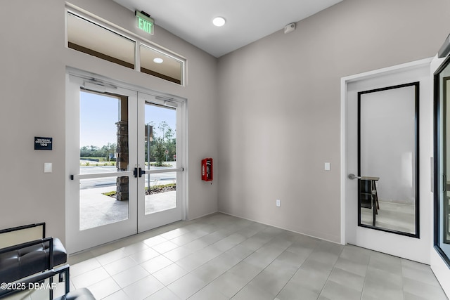 3330 Arch Ave, Ormond Beach, FL 32174 - doorway to outside featuring light tile patterned floors, french doors, and recessed lighting