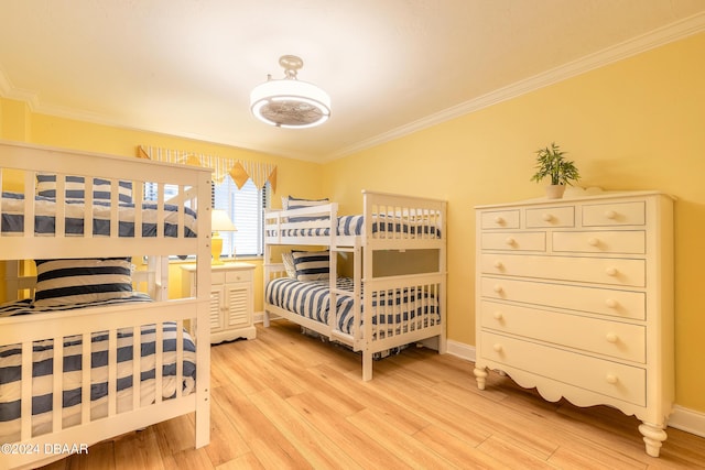 bedroom with crown molding and wood-type flooring