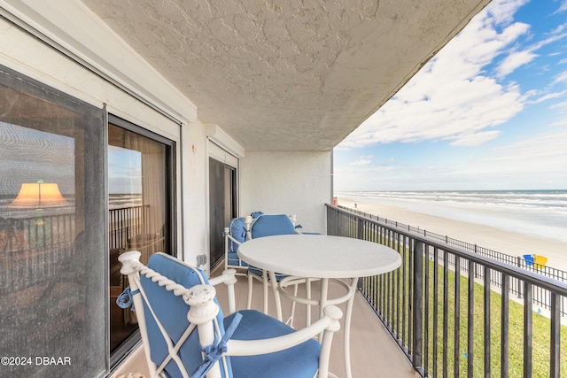 balcony with a view of the beach and a water view